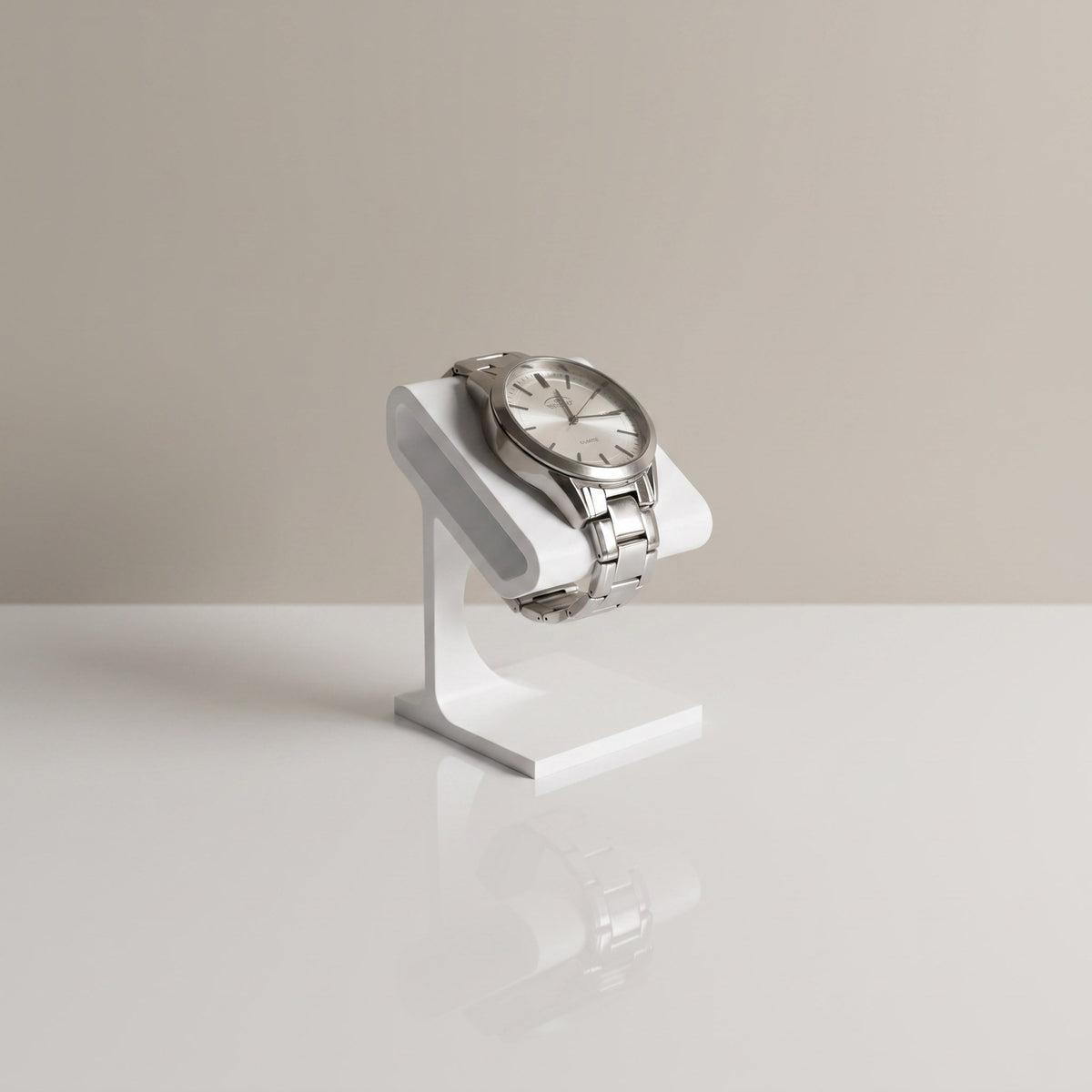 Solitaire watch stand in Ceramic white holding a steel watch